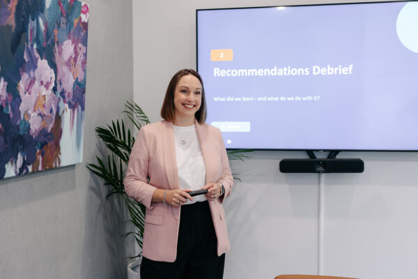 Stacey Kelly, Director at Seed People Consulting, presenting a client recommendations debrief.